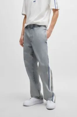 Grey relaxed-fit jeans with side poppers and contrasting tape