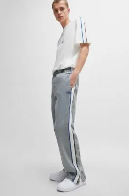 Grey relaxed-fit jeans with side poppers and contrasting tape